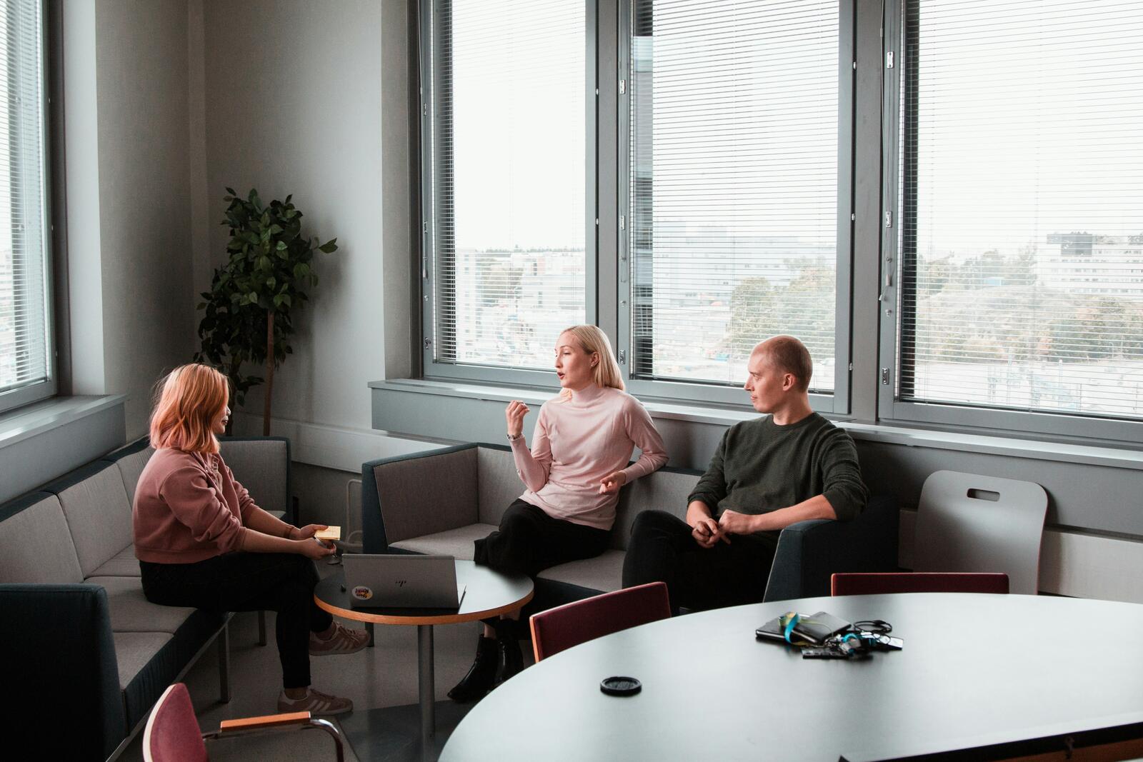 Family members talking together in a calm, neutral meeting room