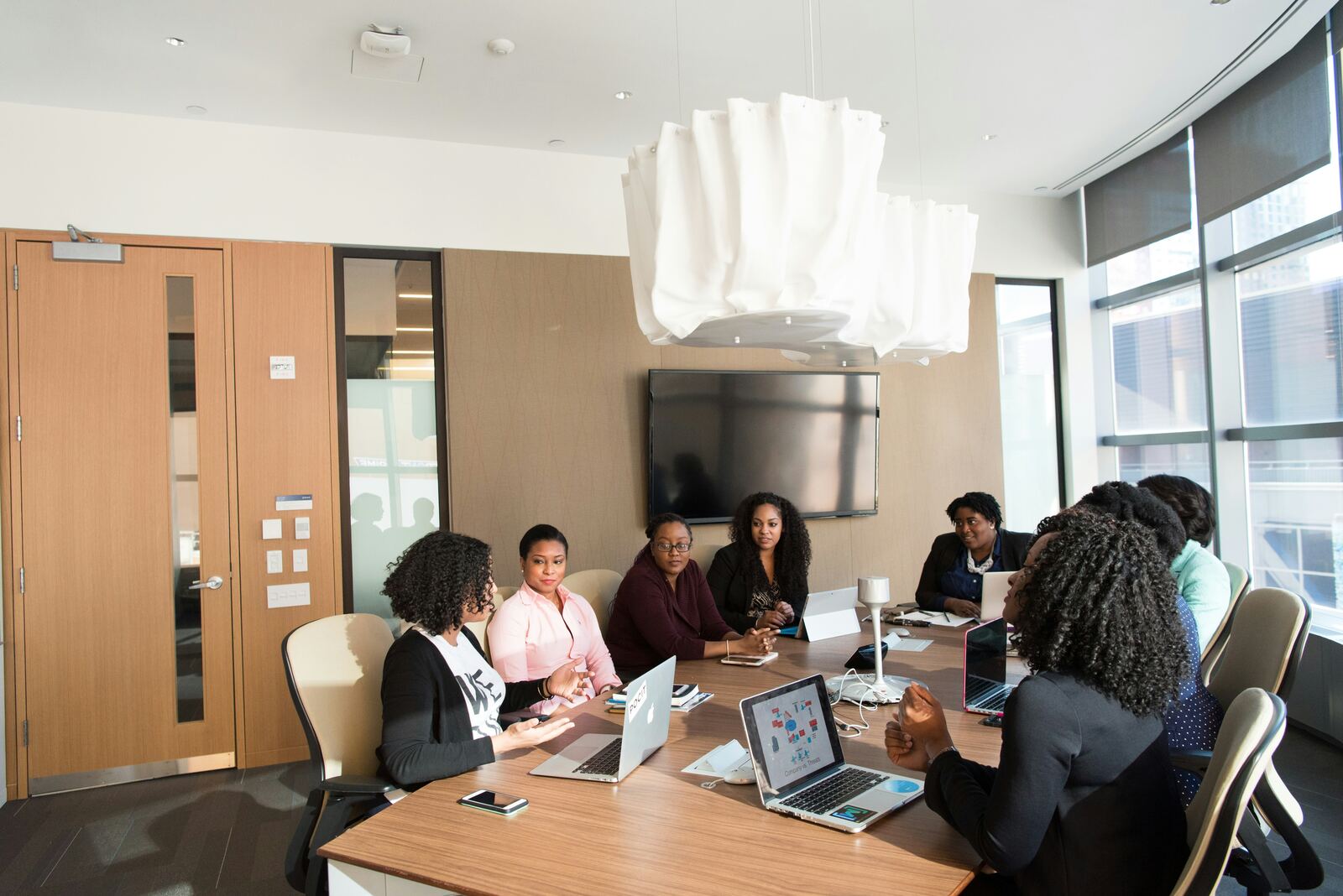 Colleagues meeting around a table in the workplace